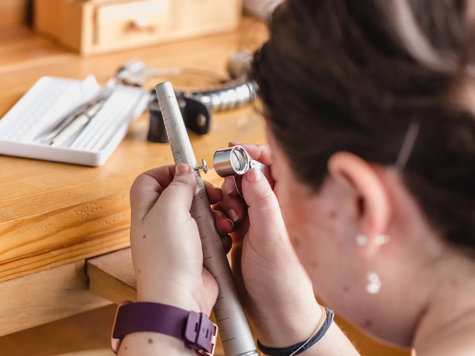 A jeweller setting a stone at the bench